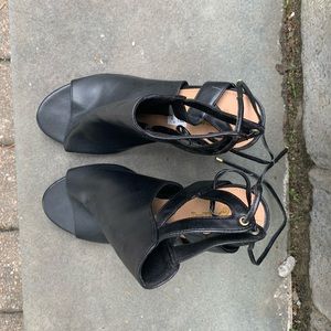 Peep toe, lace up black heels